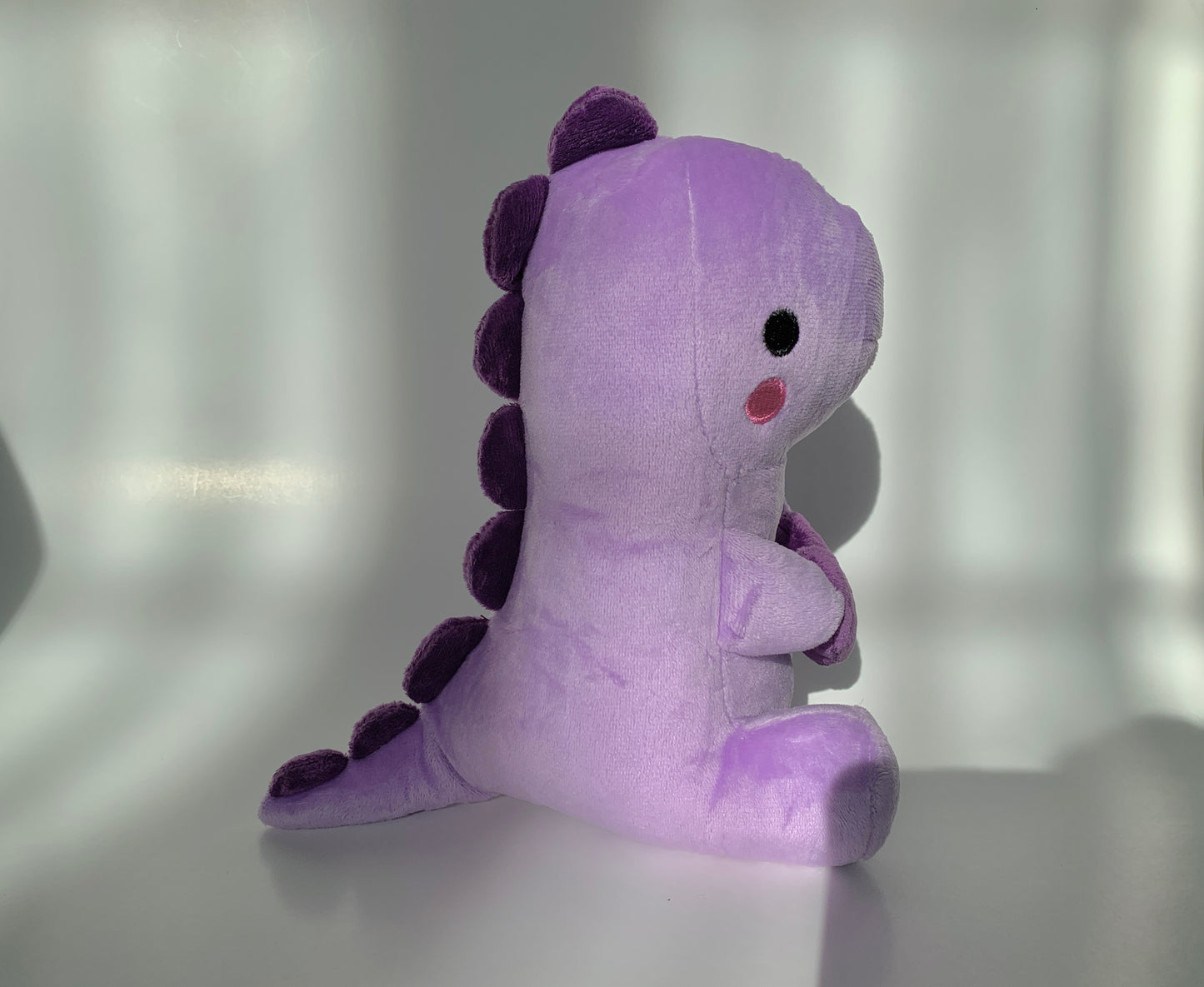 Purple heart dinosaur plushie