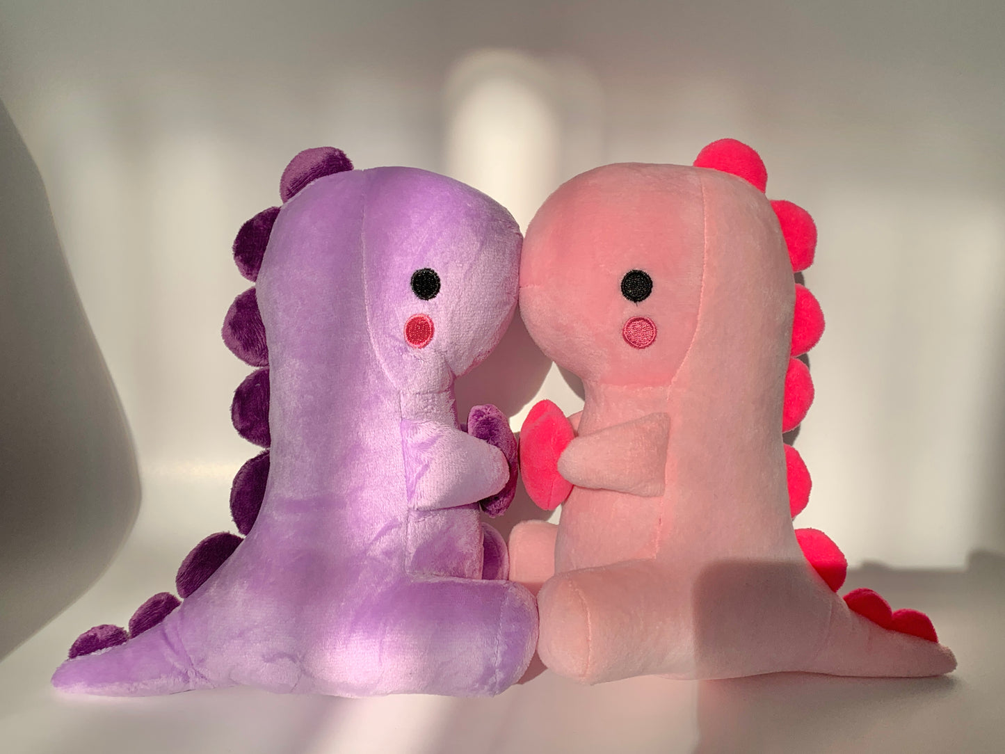 Pink and purple heart dinosaur plushies