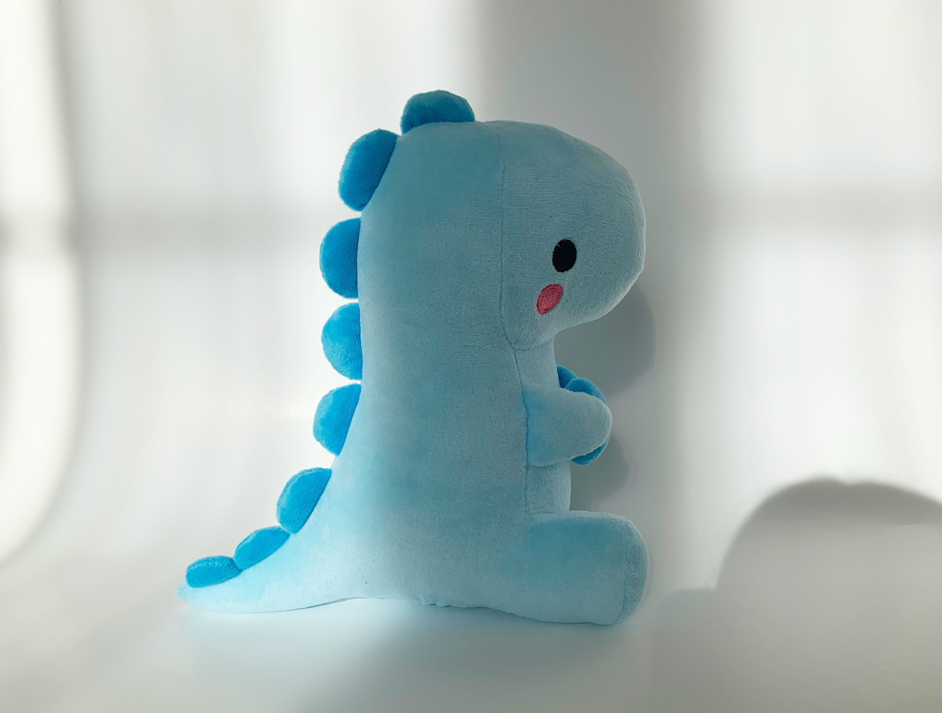 Blue plush dinosaur on sale