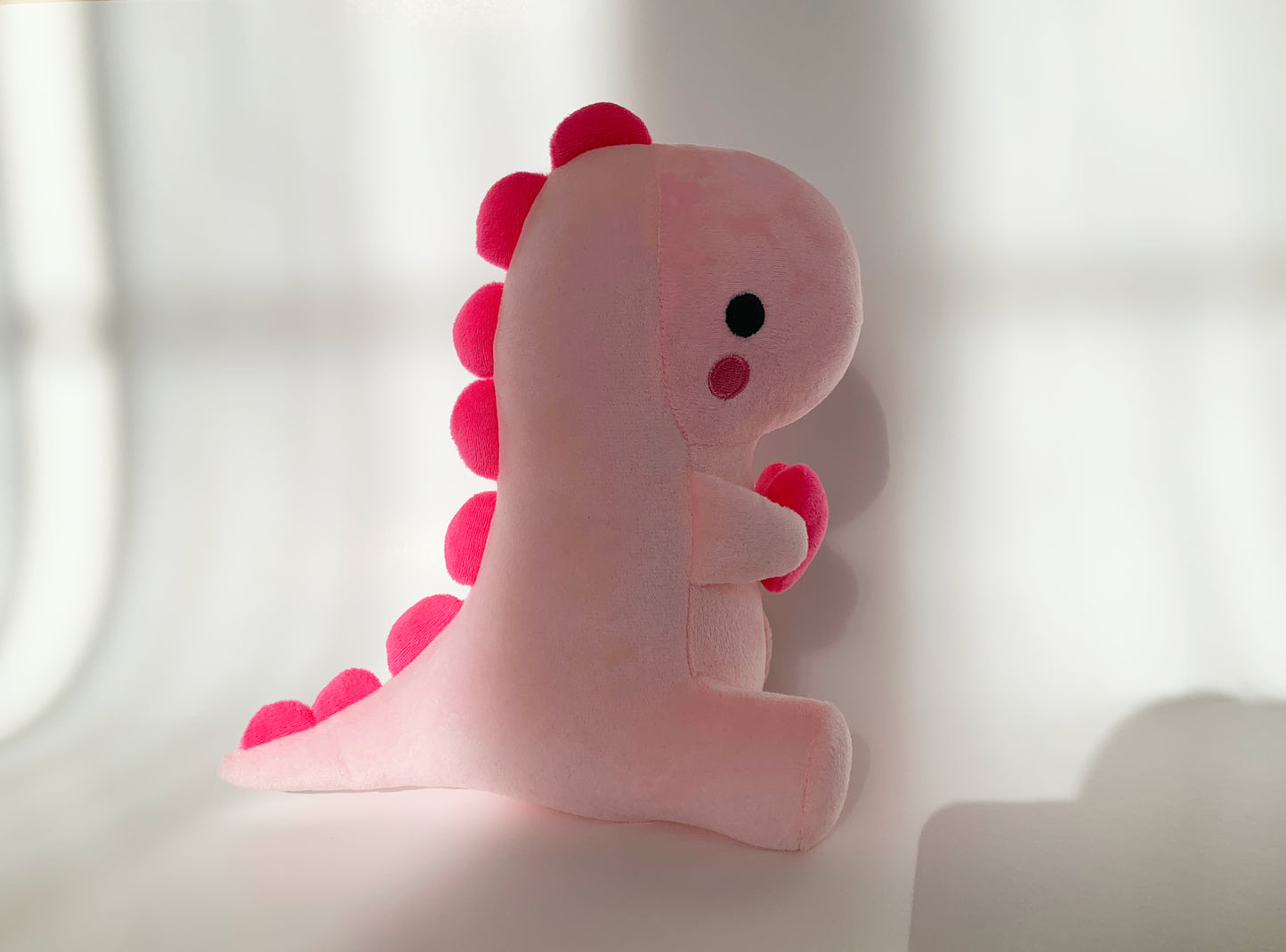 Pink heart dinosaur plushie